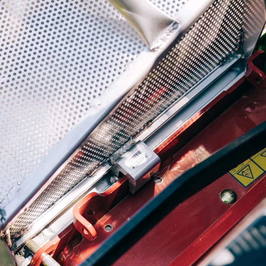 Close-up of an Accelerator grass catcher mounted on a mower deck